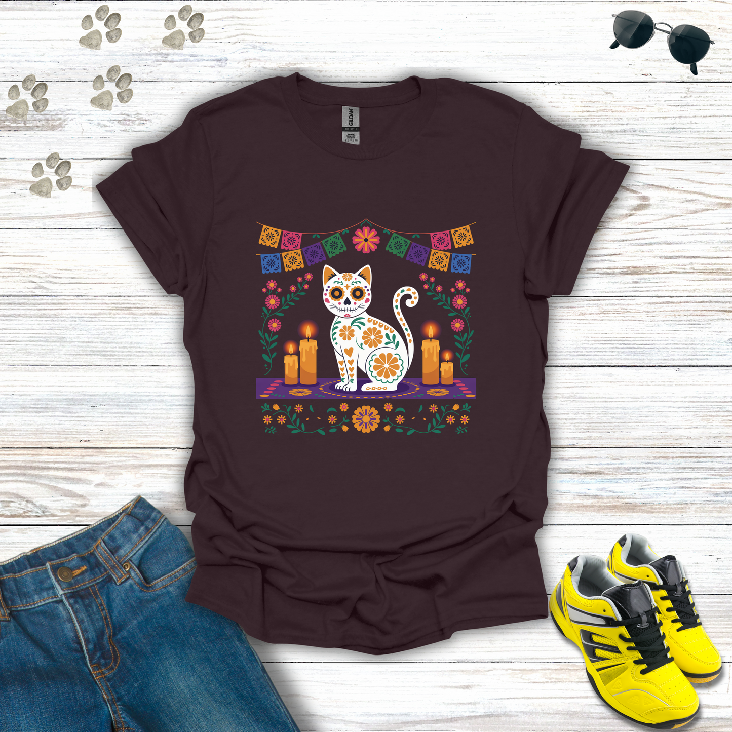 Dark Chocolate t-shirt with a colorful cat design on a wooden surface with jeans and shoes.