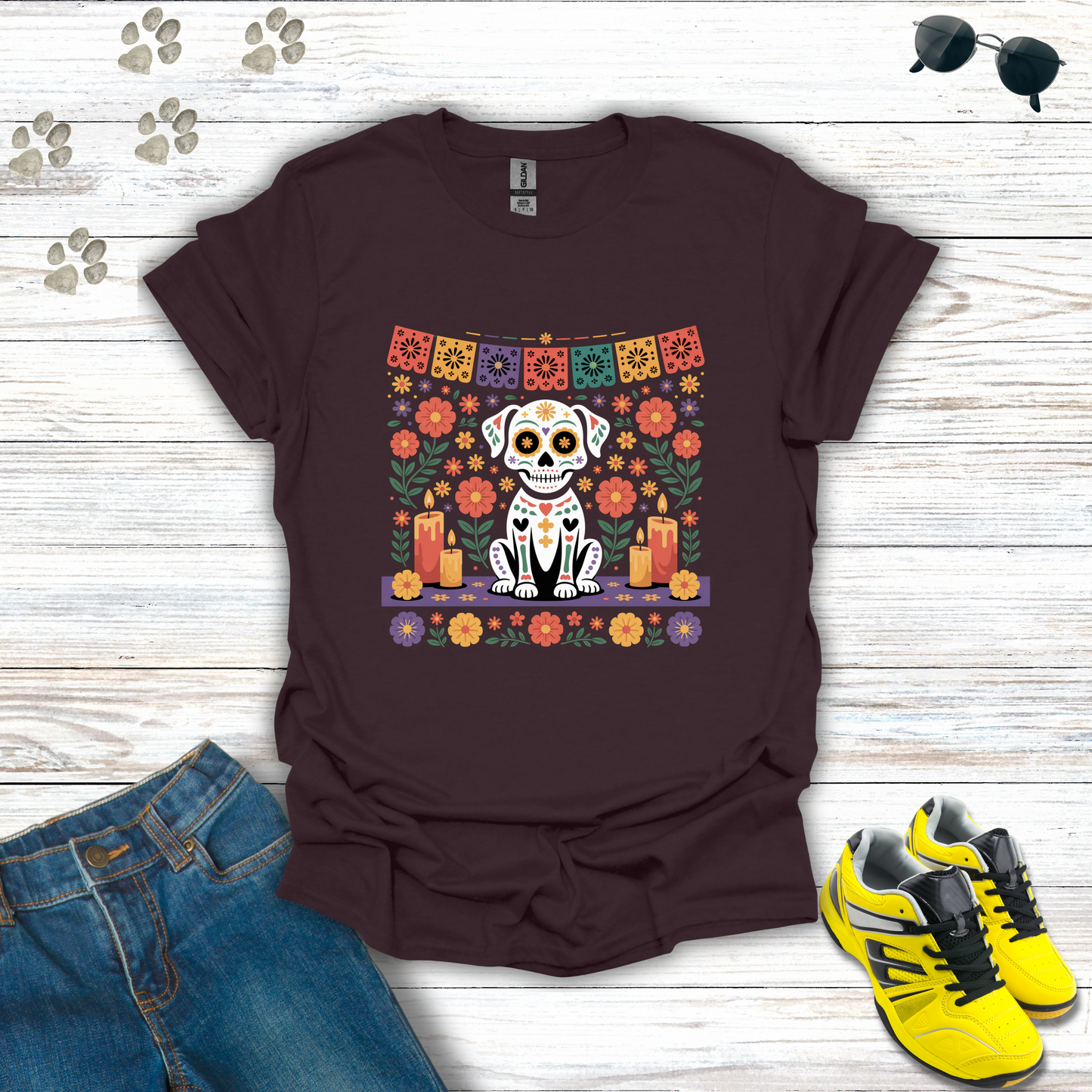 Dark Chocolate t-shirt with a dog skeleton design on a wooden surface with jeans and shoes.