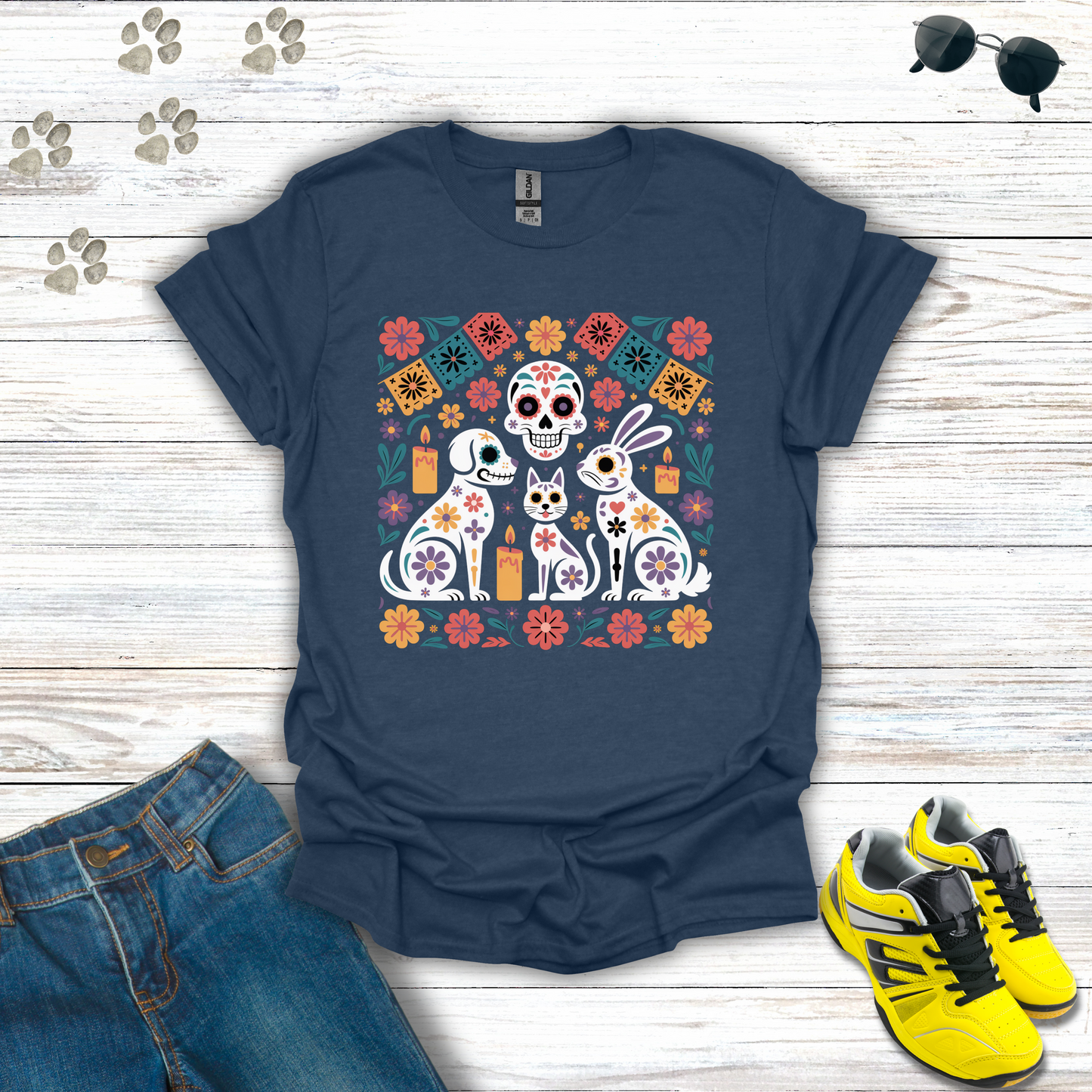 Heather Navy blue t-shirt with colorful graphic design on a wooden surface with jeans and sneakers.