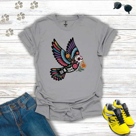 Sport Gray t-shirt with colorful skeleton bird design on a wooden surface with jeans and sneakers.