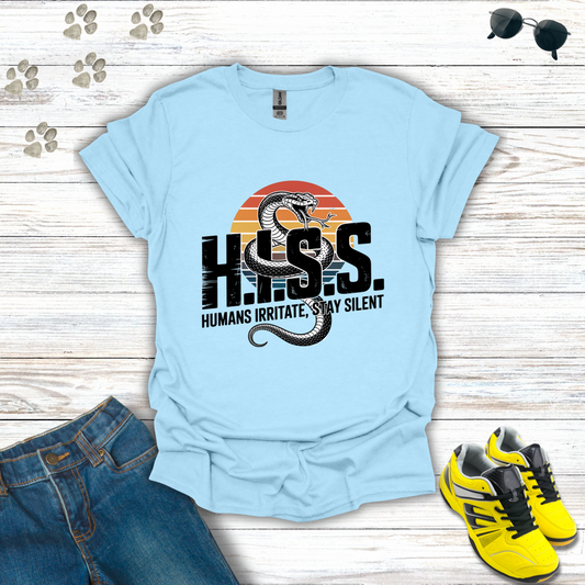 Light blue t-shirt with snake graphic and text on a wooden surface with jeans and sneakers.