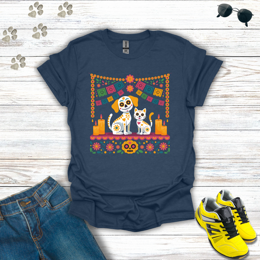 Heather Navy blue t-shirt with a colorful graphic of two dogs and a cat on a wooden surface with jeans and sneakers.