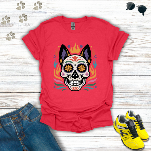 Heather Red t-shirt with a colorful skull design on a wooden surface with jeans and sneakers.