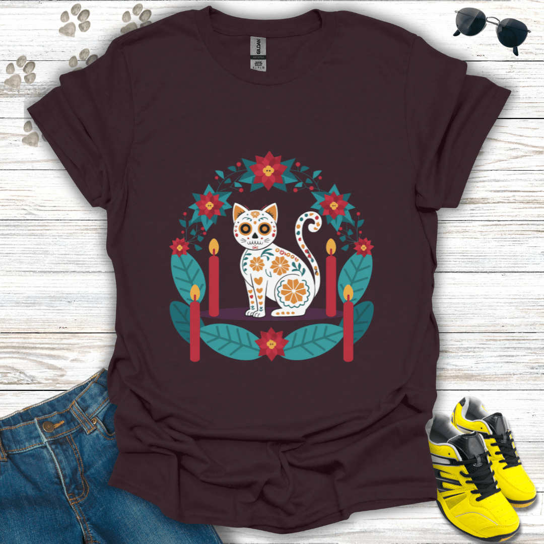 Christmas Sugar Skull Cat T-Shirt on dark chocolate Gildan tee featuring a festive white sugar-skull cat with poinsettias and candles — rich warm-toned holiday design.