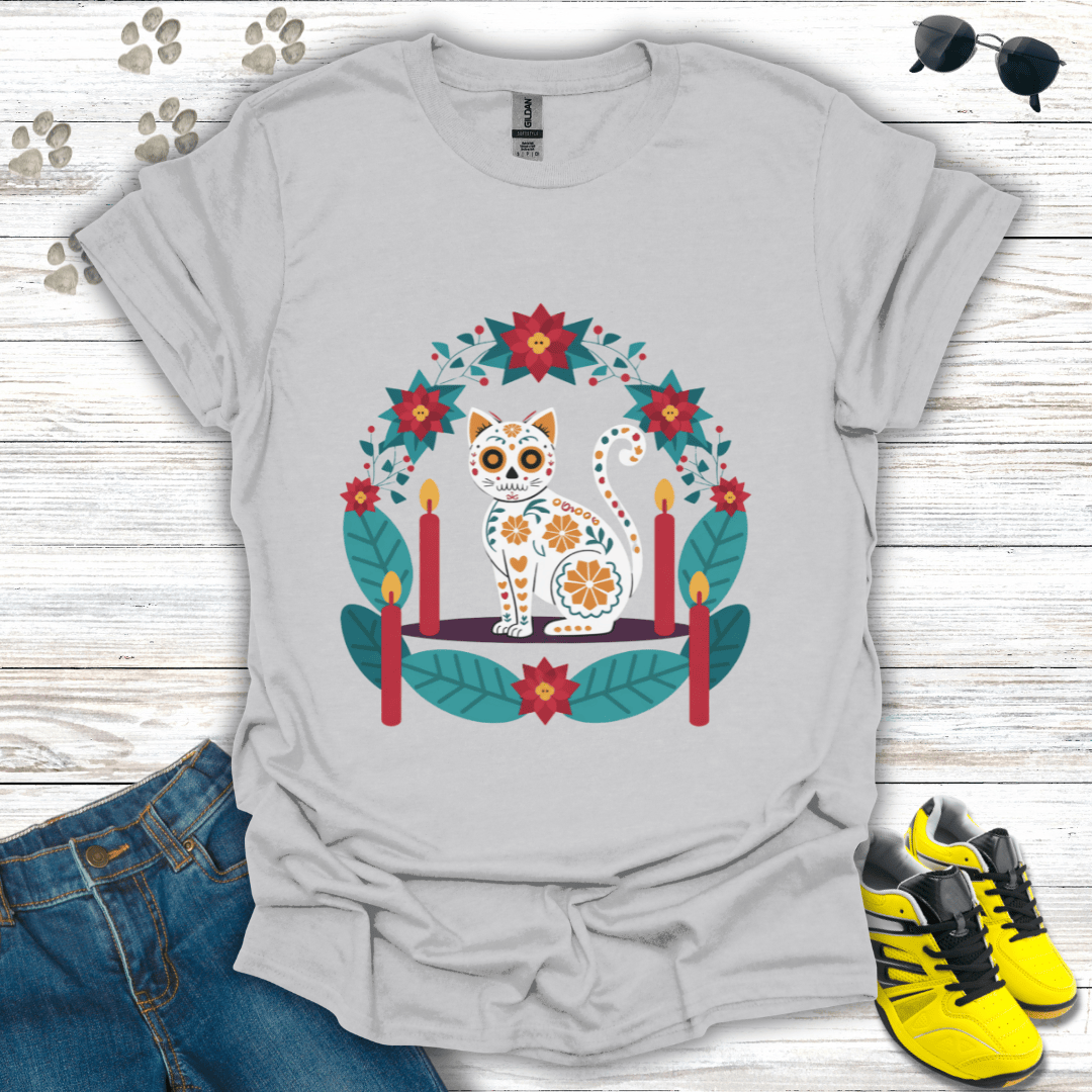 Christmas Sugar Skull Cat T-Shirt on ice grey Gildan tee displaying a sugar-skull white cat framed by teal leaves and poinsettias — soft neutral version of the festive pet design.